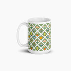 White mug with green garden lattice fence pattern on a white background