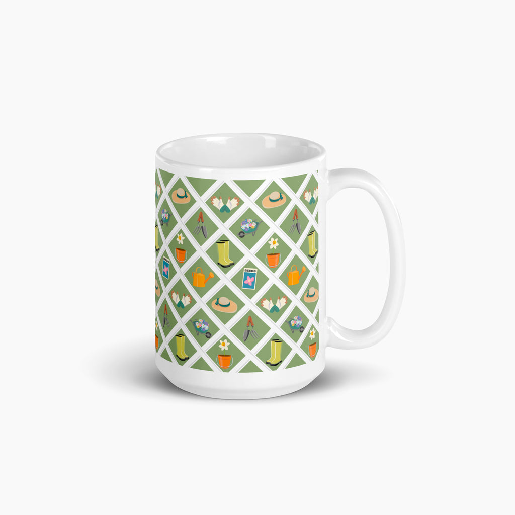 White mug with green garden lattice fence pattern on a white background