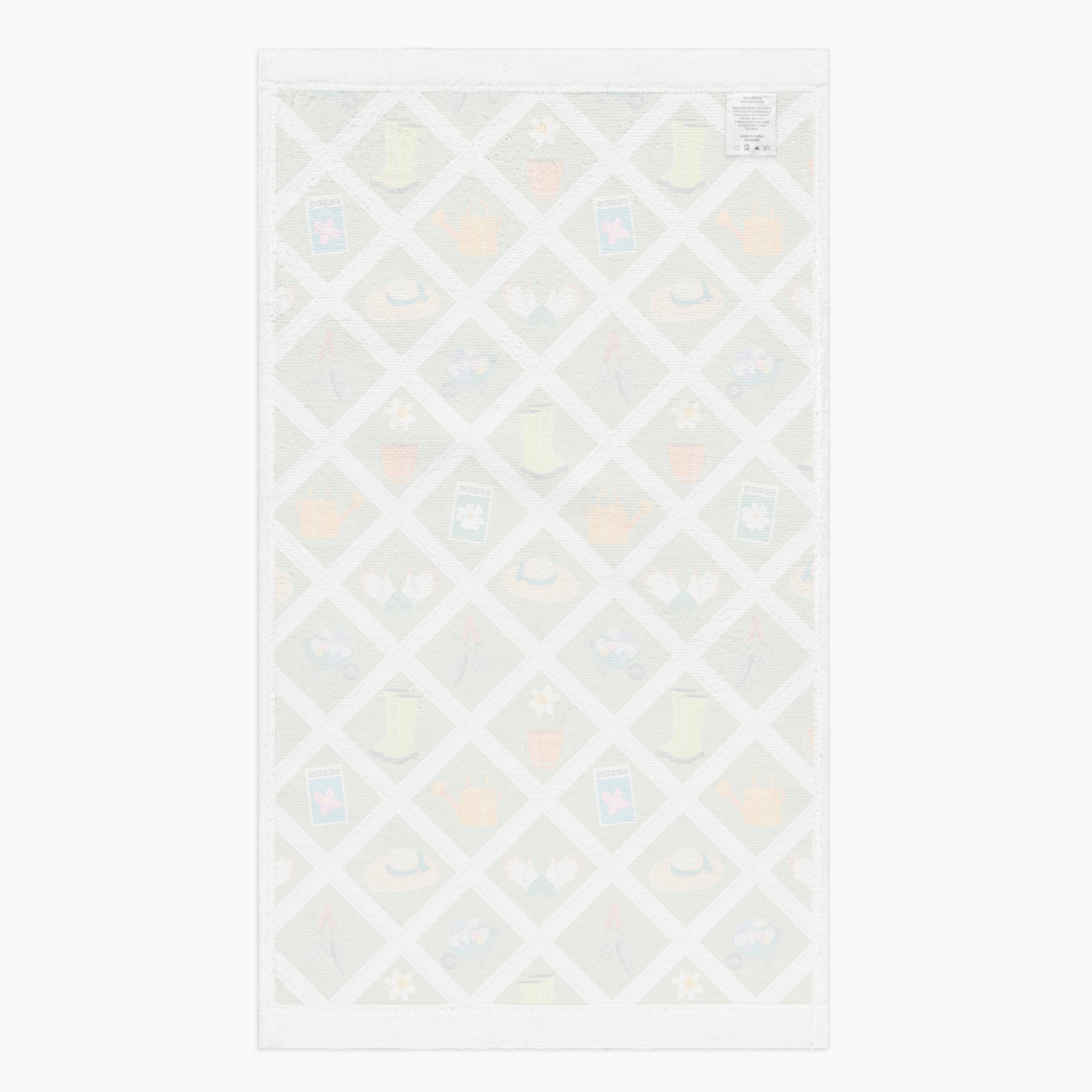White back of Cloth kitchen hand towel with green garden-themed pattern on a white background