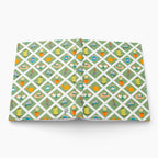 Hardcover journal with green garden lattice fence patterned cover design on a white background