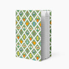 Hardcover journal with green garden lattice fence patterned cover design and lined pages on a white background