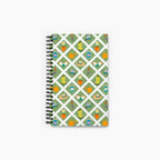 Spiral Notebook with gardening-themed pattern on a white background