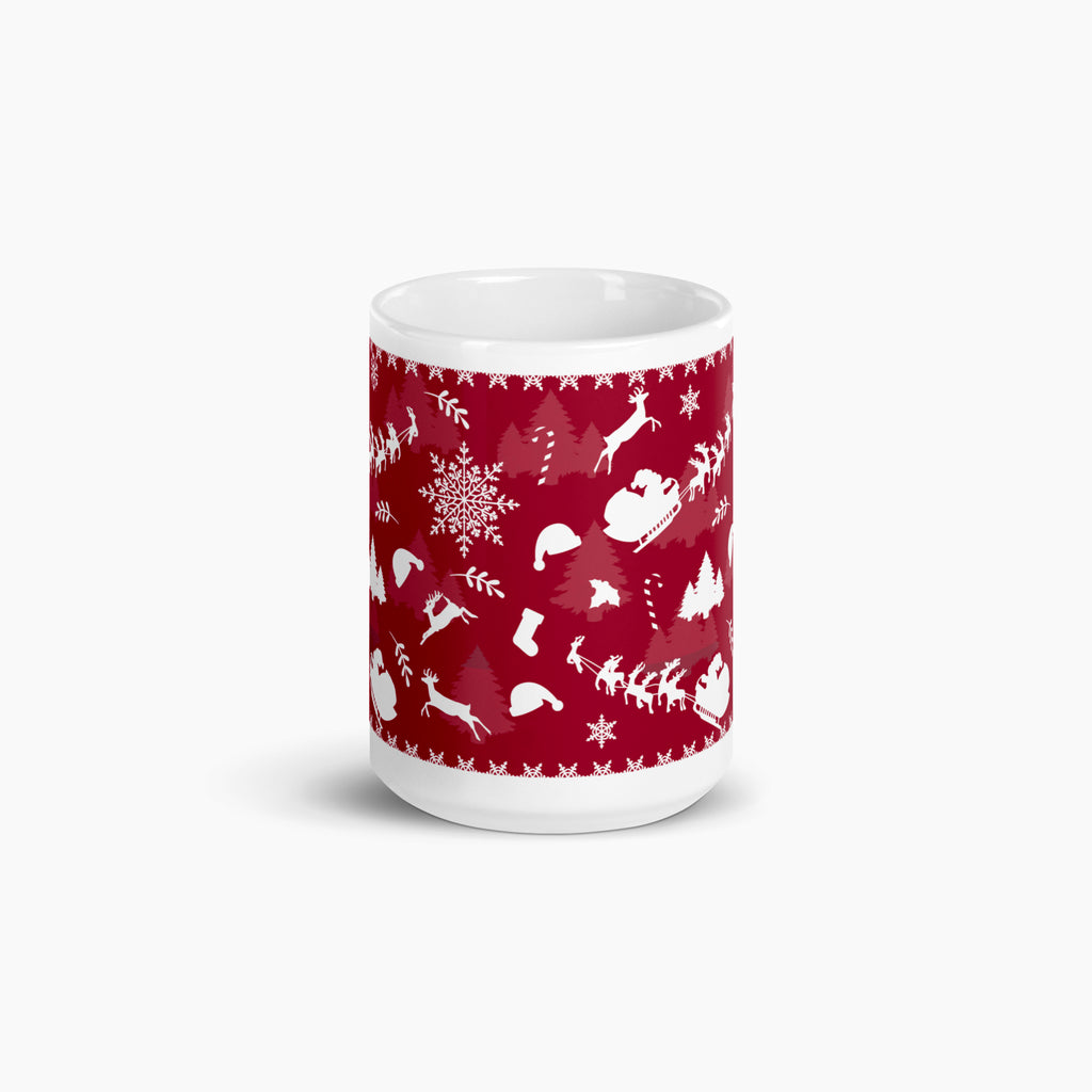 A white ceramic mug featuring a festive deep red wraparound print with white holiday silhouettes, including snowflakes, trees, Santa hats, sleighs, and reindeer shown against a light grey background.