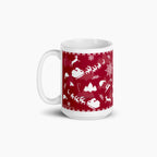 A white ceramic mug featuring a festive deep red wraparound print with white holiday silhouettes, including snowflakes, trees, Santa hats, sleighs, and reindeer shown against a light grey background.