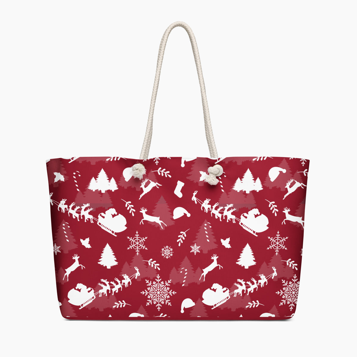 A deep red tote bag with a white Christmas-themed pattern featuring Santa Claus, reindeer, snowflakes, and trees, complete with two cream rope handles.