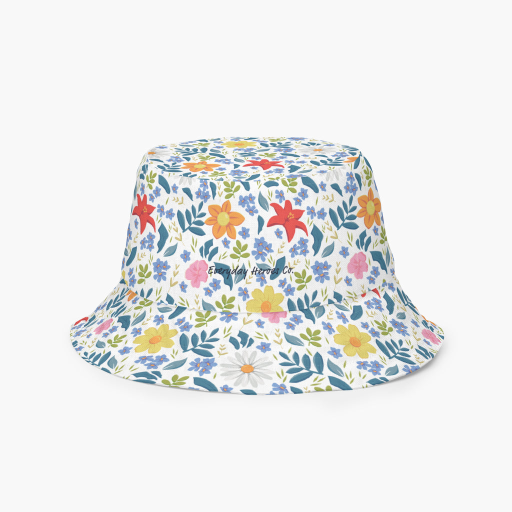Reversible bucket hat with custom printed white floral design on a white background