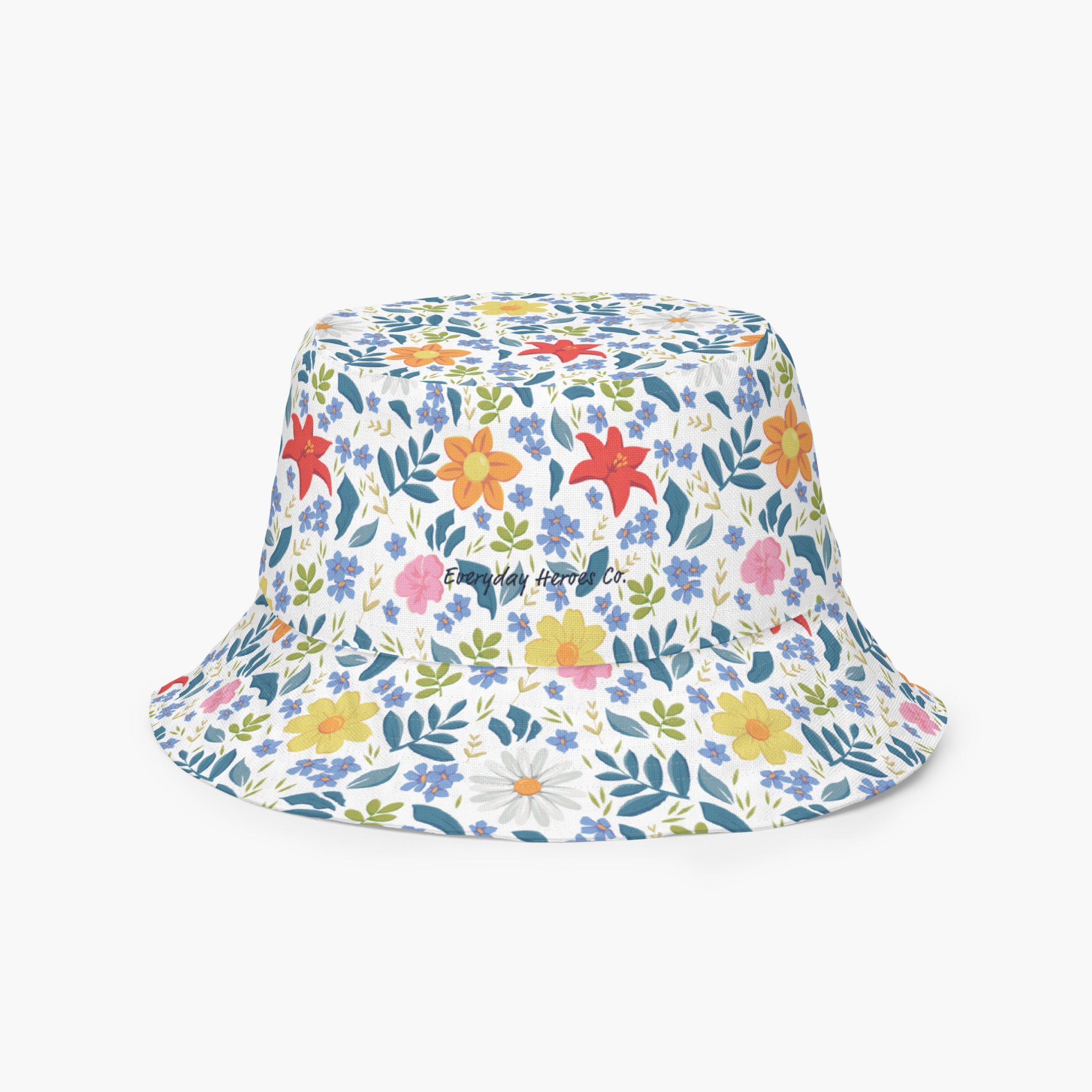 Reversible bucket hat with custom printed white floral design on a white background
