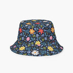 Reversible bucket hat with custom printed blue floral design on a white background