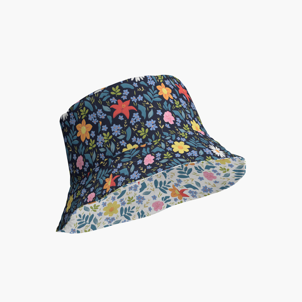 Reversible bucket hat with custom printed blue floral design on a white background