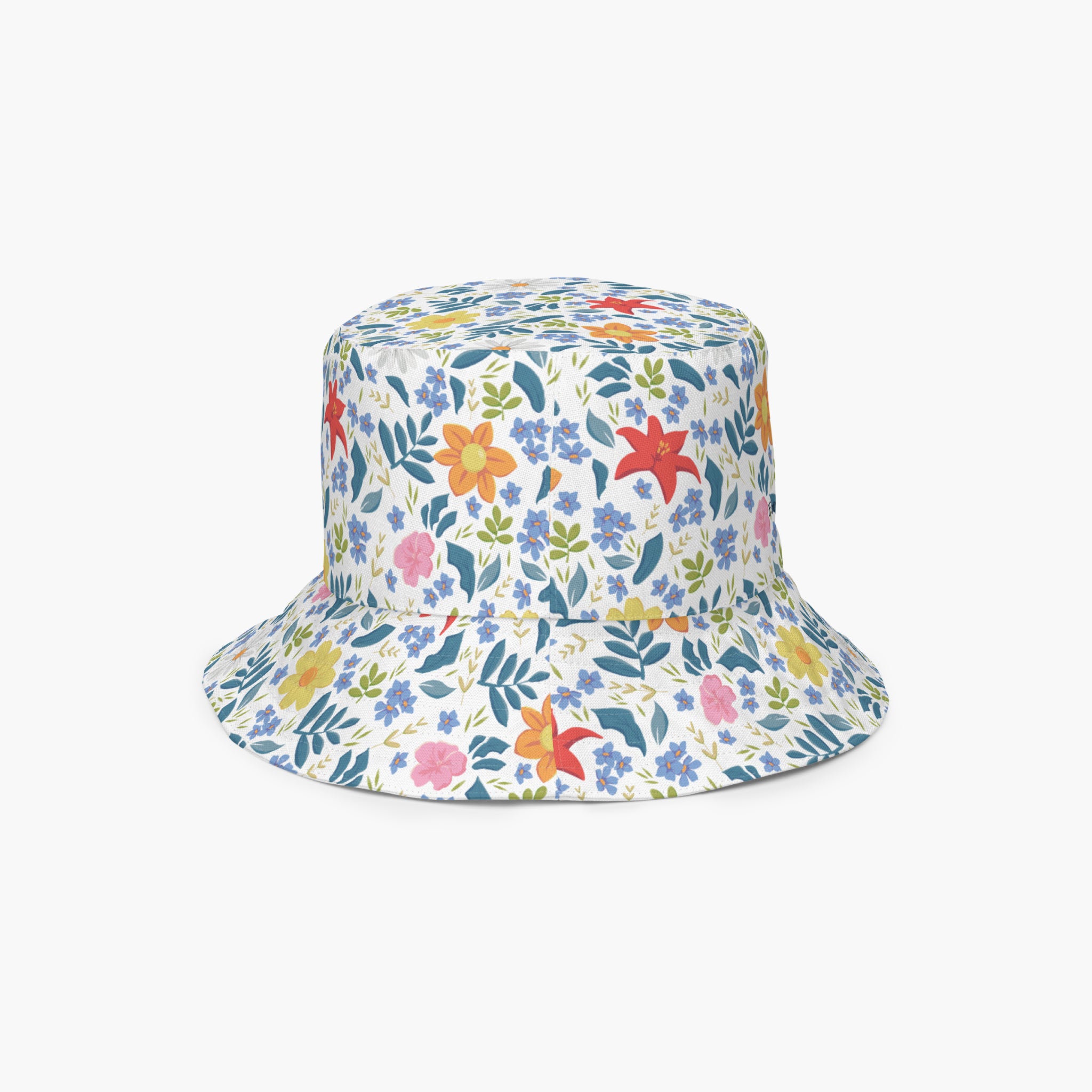 Reversible bucket hat with custom printed white floral design on a white background