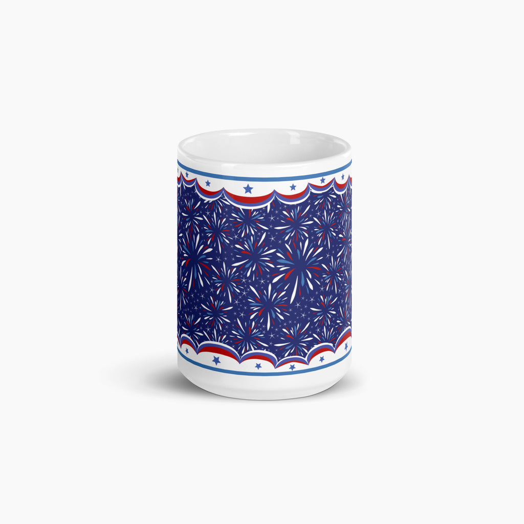 White mug with blue and fireworks design on a white background