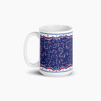 White mug with blue and fireworks design on a white background