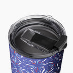 Tumbler with a blue fireworks-themed pattern on a white background