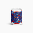 White mug with blue and patriotic symbols design on a white background