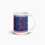 White mug with blue and patriotic symbols design on a white background