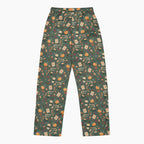 A pair of dark green drawstring pajama pants featuring an all-over pumpkin spice-themed print with coffee cups, leaves, and pumpkins, shown against a plain light grey background.