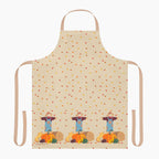 A beige apron with a light tan neck loop and side ties, decorated with a repeating pattern of scattered autumn leaves and three scarecrows standing next to pumpkins at the bottom.