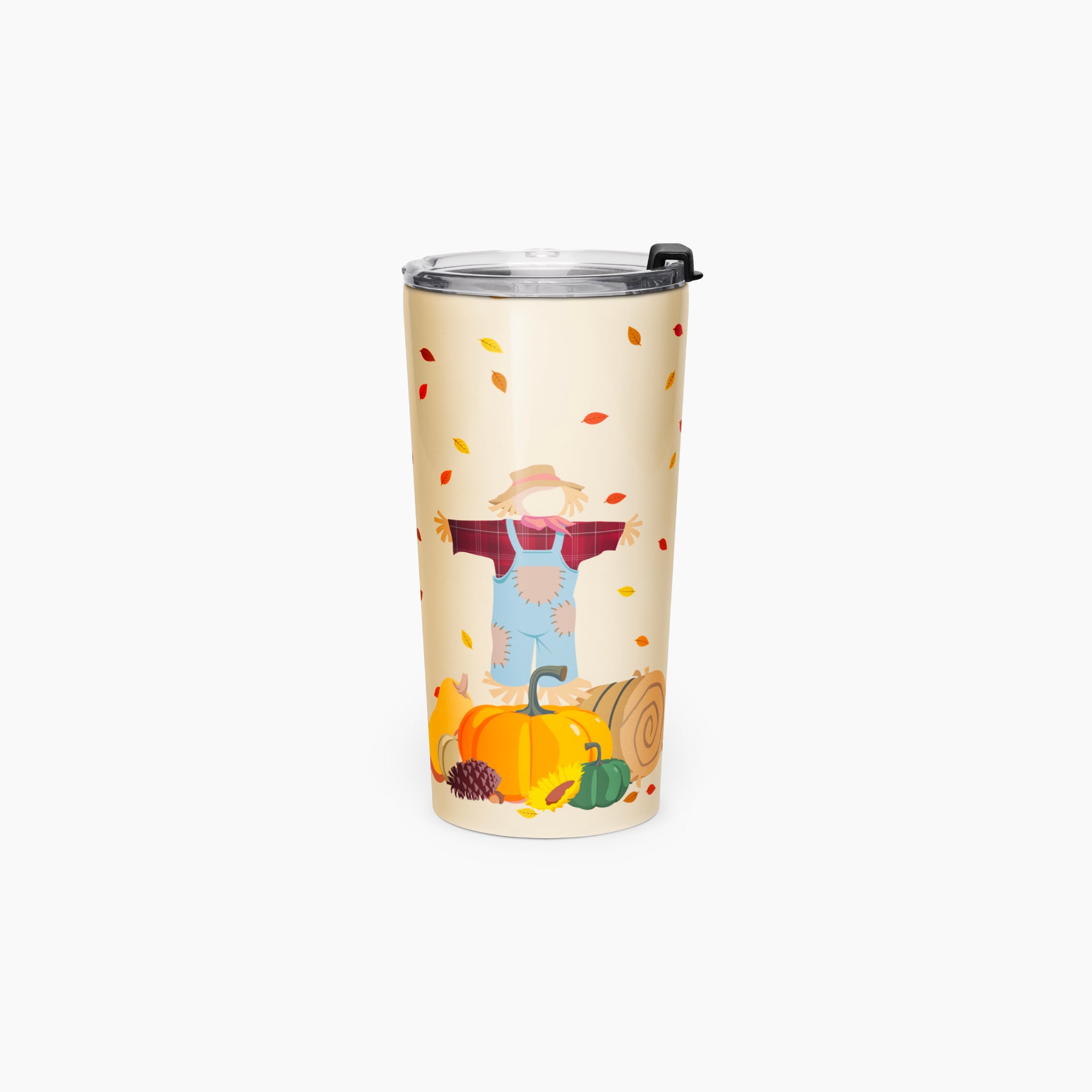A tall insulated travel tumbler with a clear lid, featuring a printed autumn harvest design with a scarecrow, pumpkins, fall leaves, and a hay bale on a light grey background.