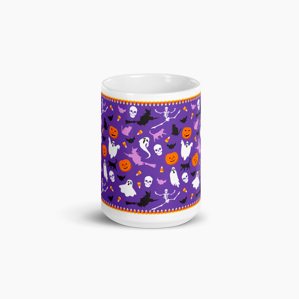 A white ceramic mug featuring a vibrant purple Halloween-themed pattern with orange, black, and white illustrations of pumpkins, ghosts, bats, and witches, set against a clean white background.