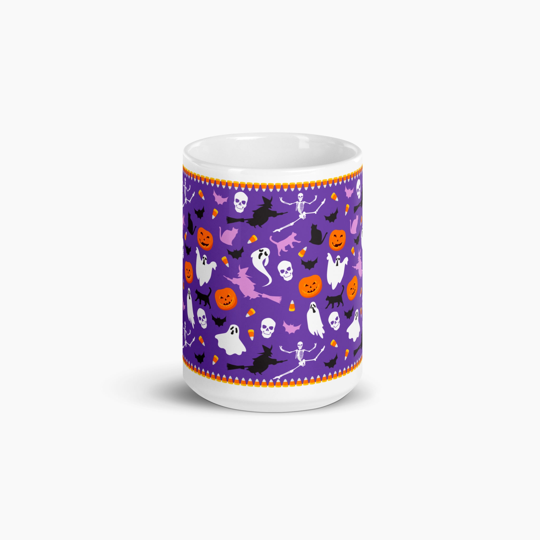 A white ceramic mug featuring a vibrant purple Halloween-themed pattern with orange, black, and white illustrations of pumpkins, ghosts, bats, and witches, set against a clean white background.