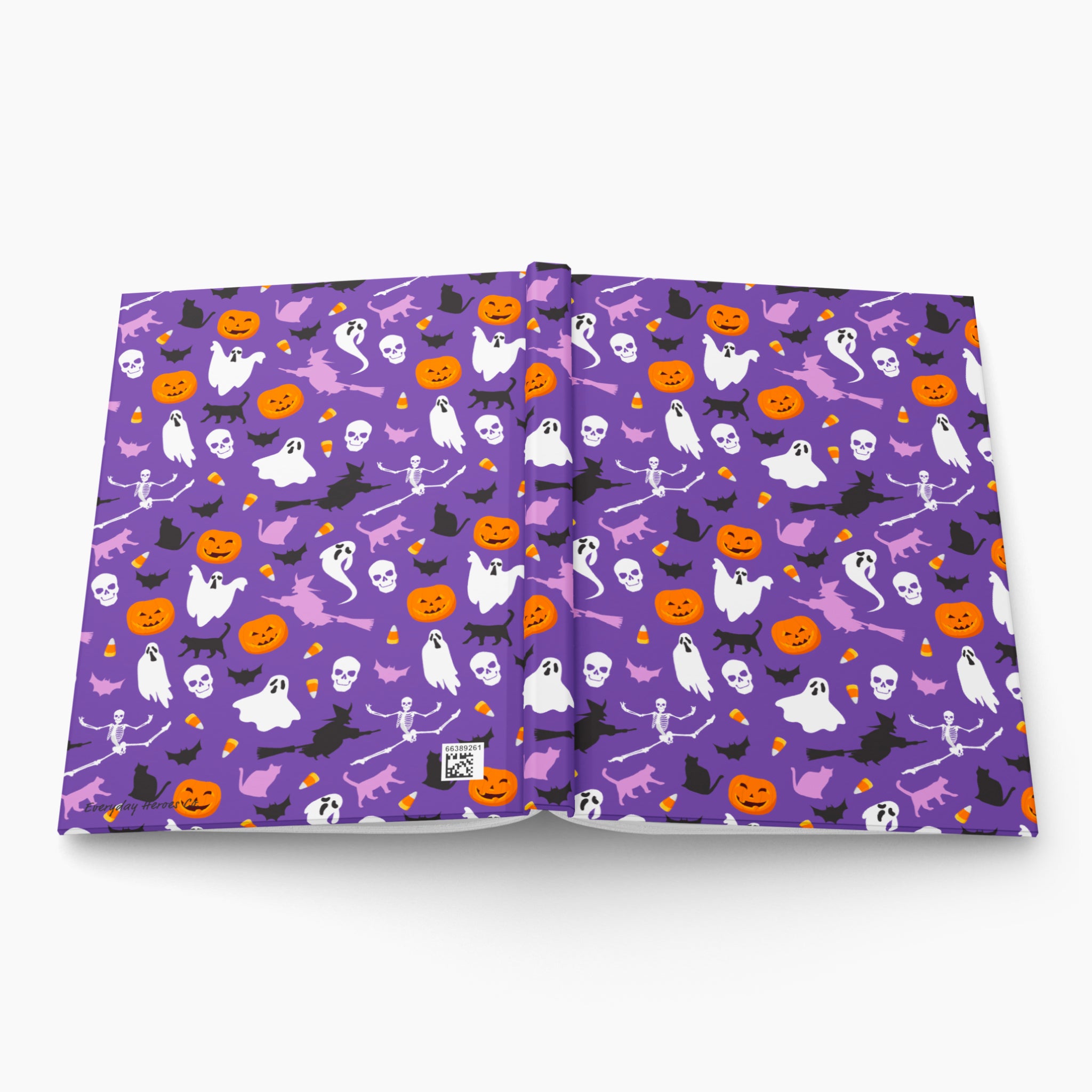 A hardcover notebook or journal shown open flat against a light gray background. The cover features a repeating Halloween pattern with purple background, orange pumpkins, white ghosts, black bats, and small yellow stars.