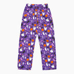 Purple Halloween-themed pajama pants with an all-over print of white ghosts, orange pumpkins, black bats, and purple witch, shown flat against a light gray background.