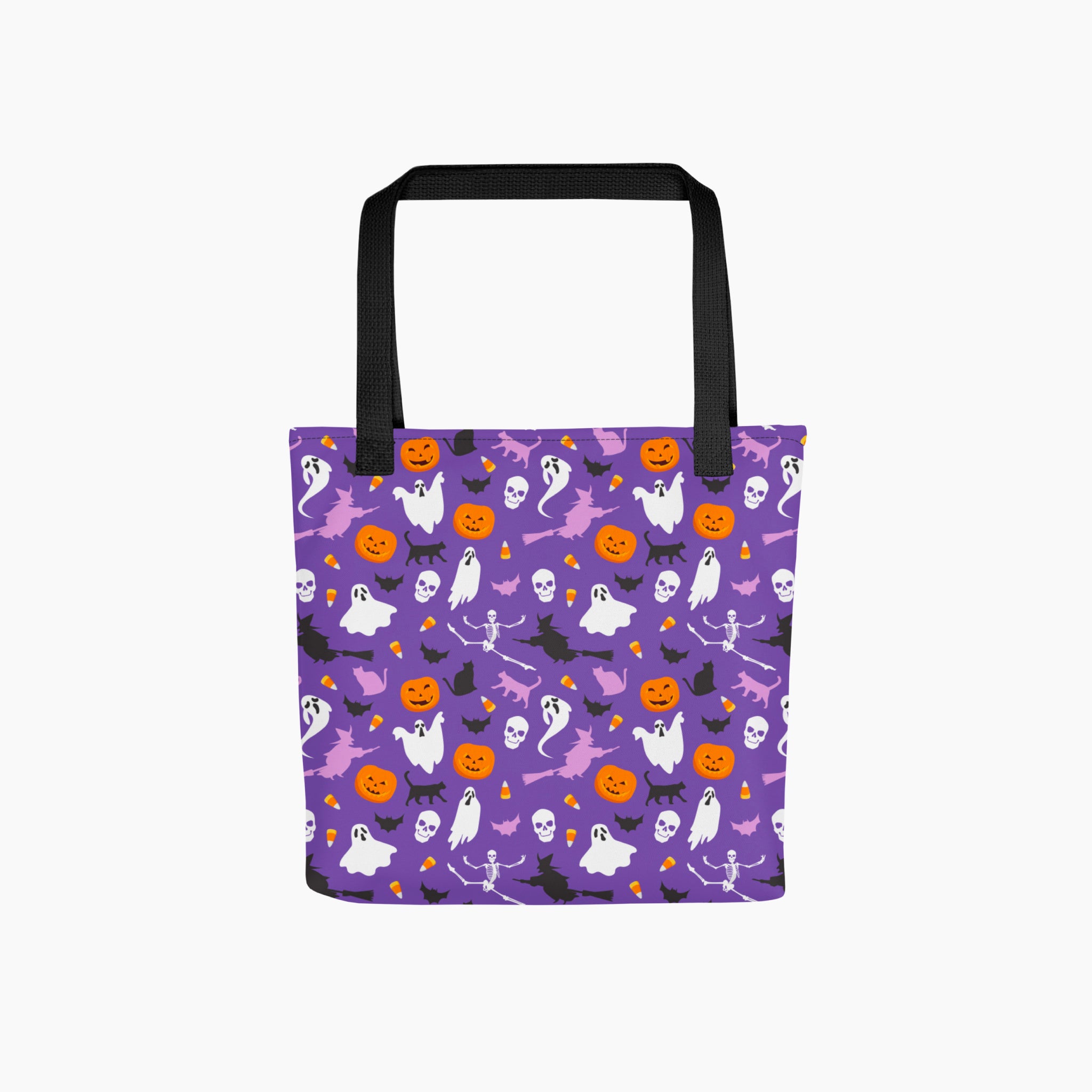 A purple tote bag with a black handle, featuring a repeating Halloween pattern of white ghosts, orange pumpkins, black bats, witches and skulls on a light grey background.