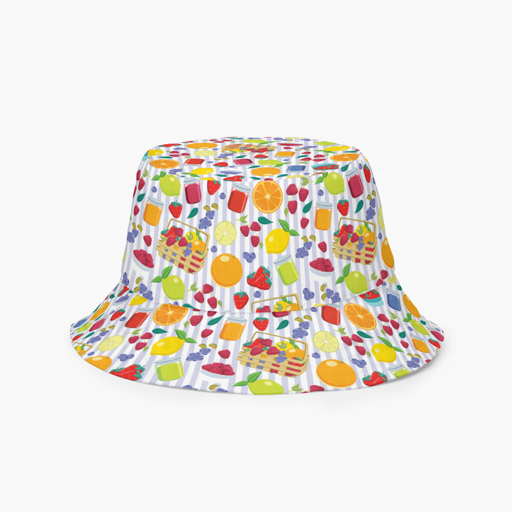 Reversible bucket hat with colorful summer fruit pattern on a white background