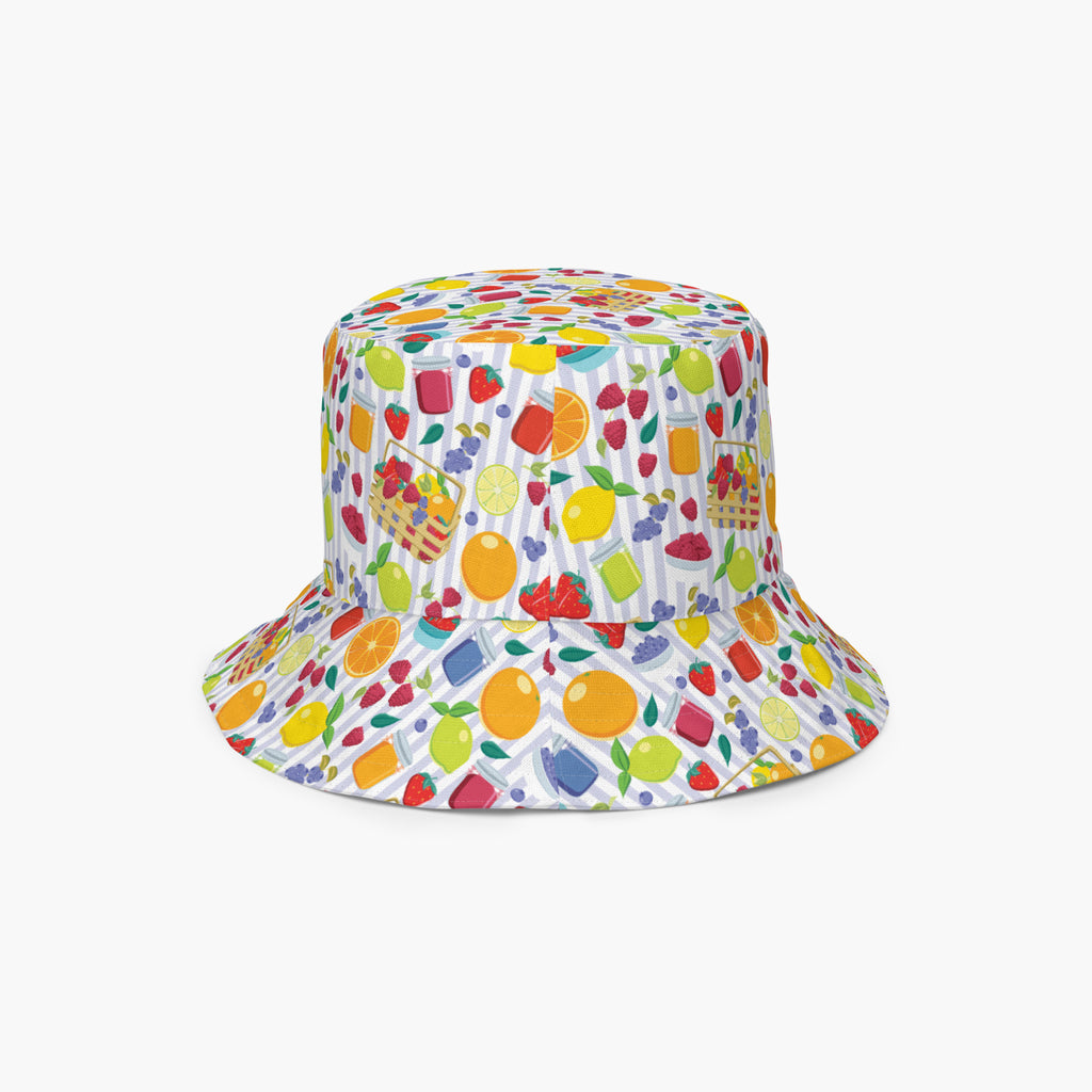 Reversible bucket hat with colorful summer fruit pattern on a white background