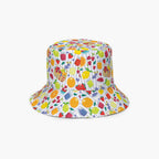 Reversible bucket hat with colorful summer fruit pattern on a white background