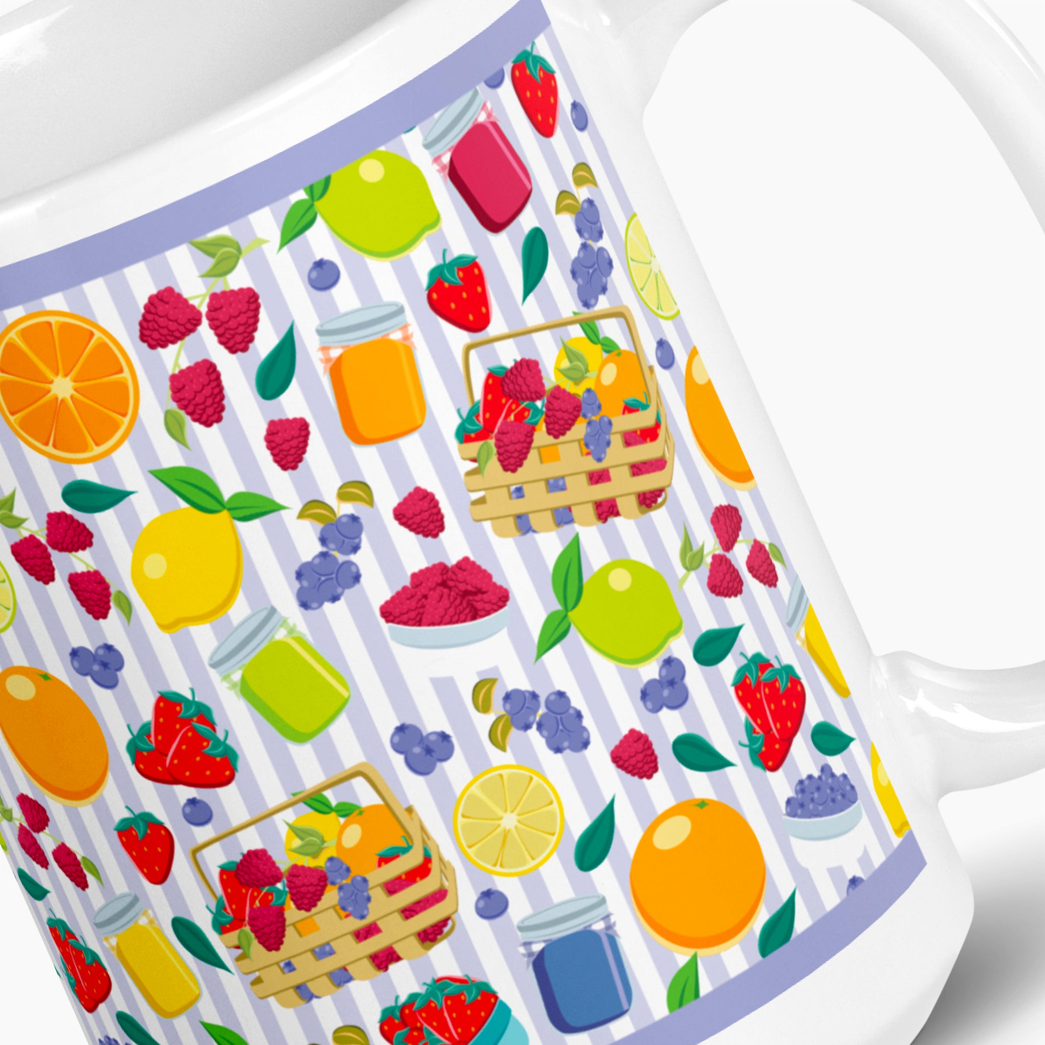 White mug with colorful summer fruit pattern on a white background