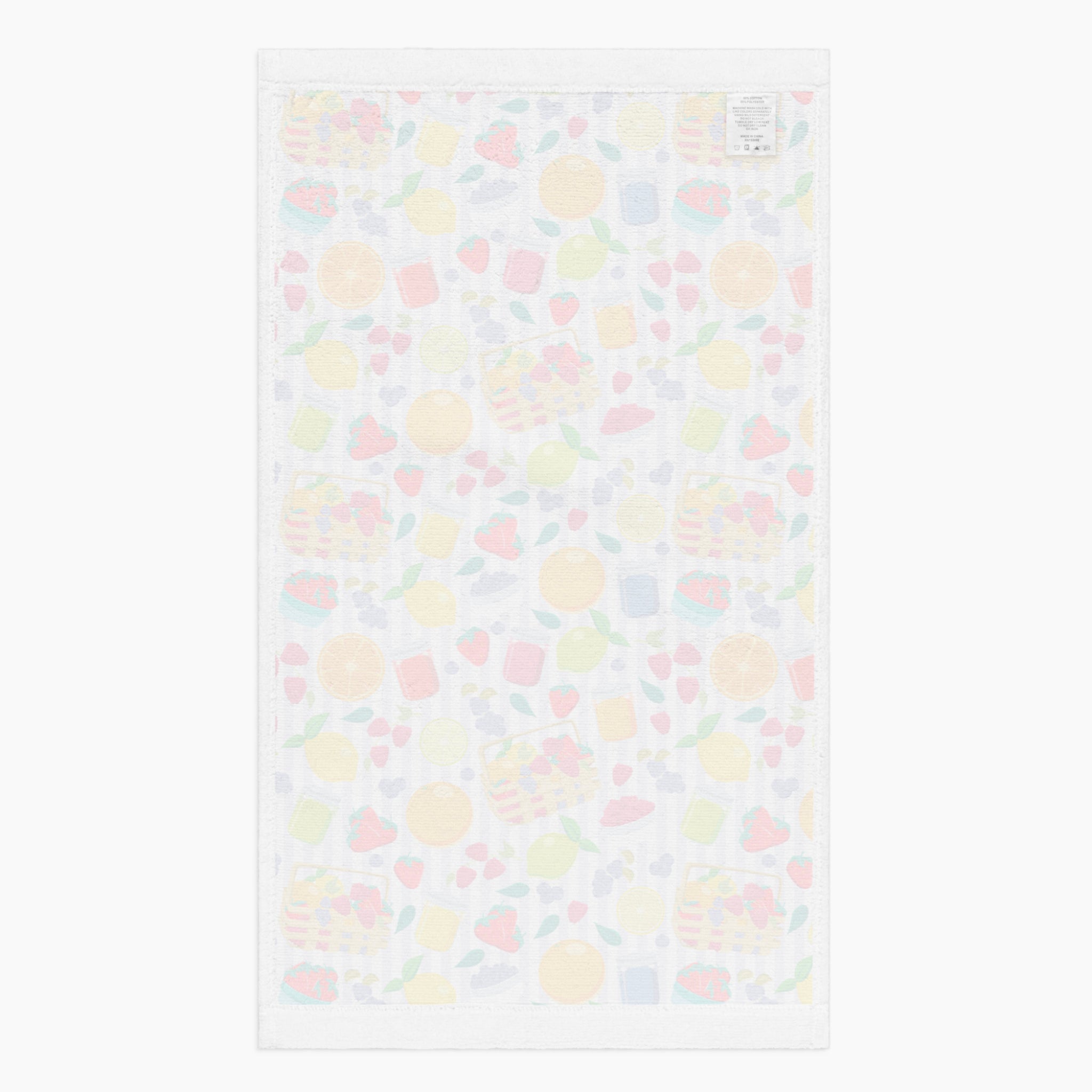 White back of cloth kitchen hand towel with summer fruits pattern on a white background