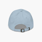 Light blue baseball cap with a brown buckle on a white background