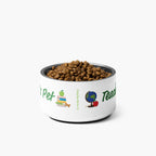White pet bowl with dog food labeled 'Teach Pet' on a white background