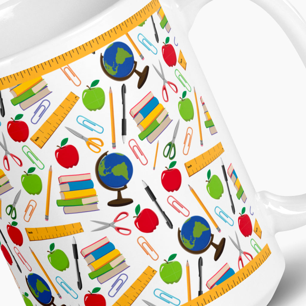 White mug with colorful teacher-themed pattern on a white background