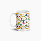 White mug with colorful teacher-themed pattern on a white background