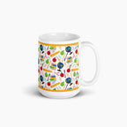 White mug with colorful teacher-themed pattern on a white background
