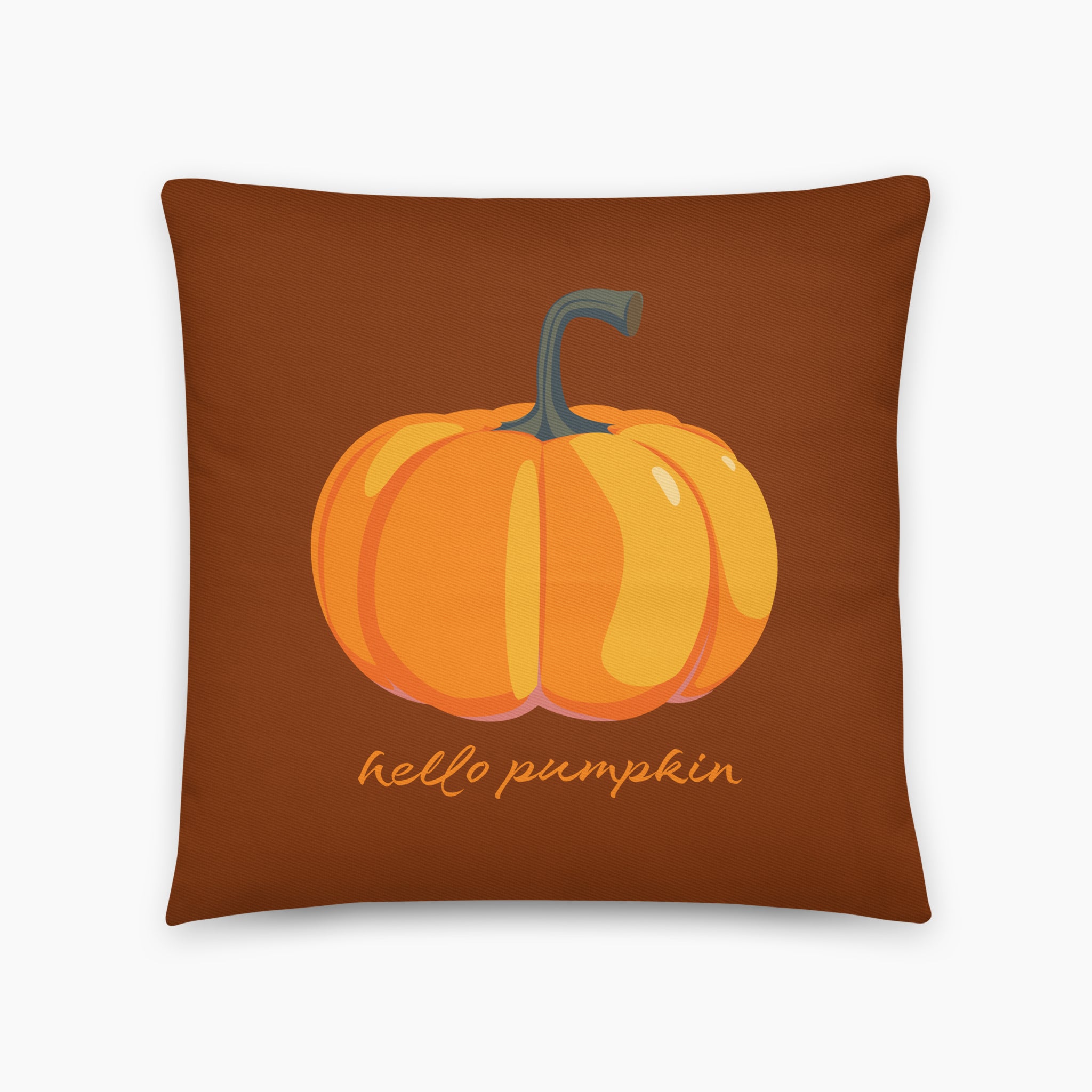 Square throw pillow with a orange pumpkin printed on a brown cover with the message "hello pumpkin" printed in script below. The pillow is staged on a light grey studio background.
