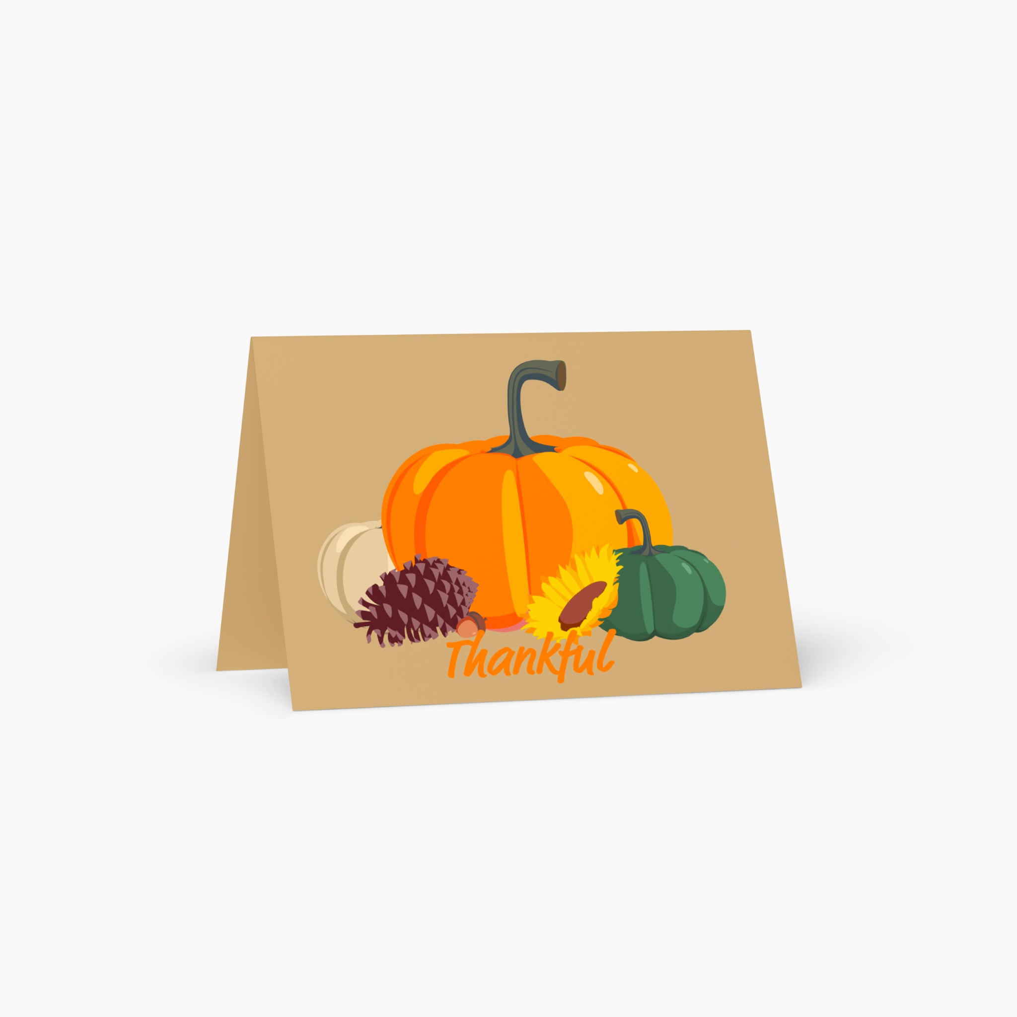 A folded greeting card standing upright on a light grey background, featuring an autumn illustration with pumpkins, a pinecone, a sunflower, and the word 'Thankful' in orange script.