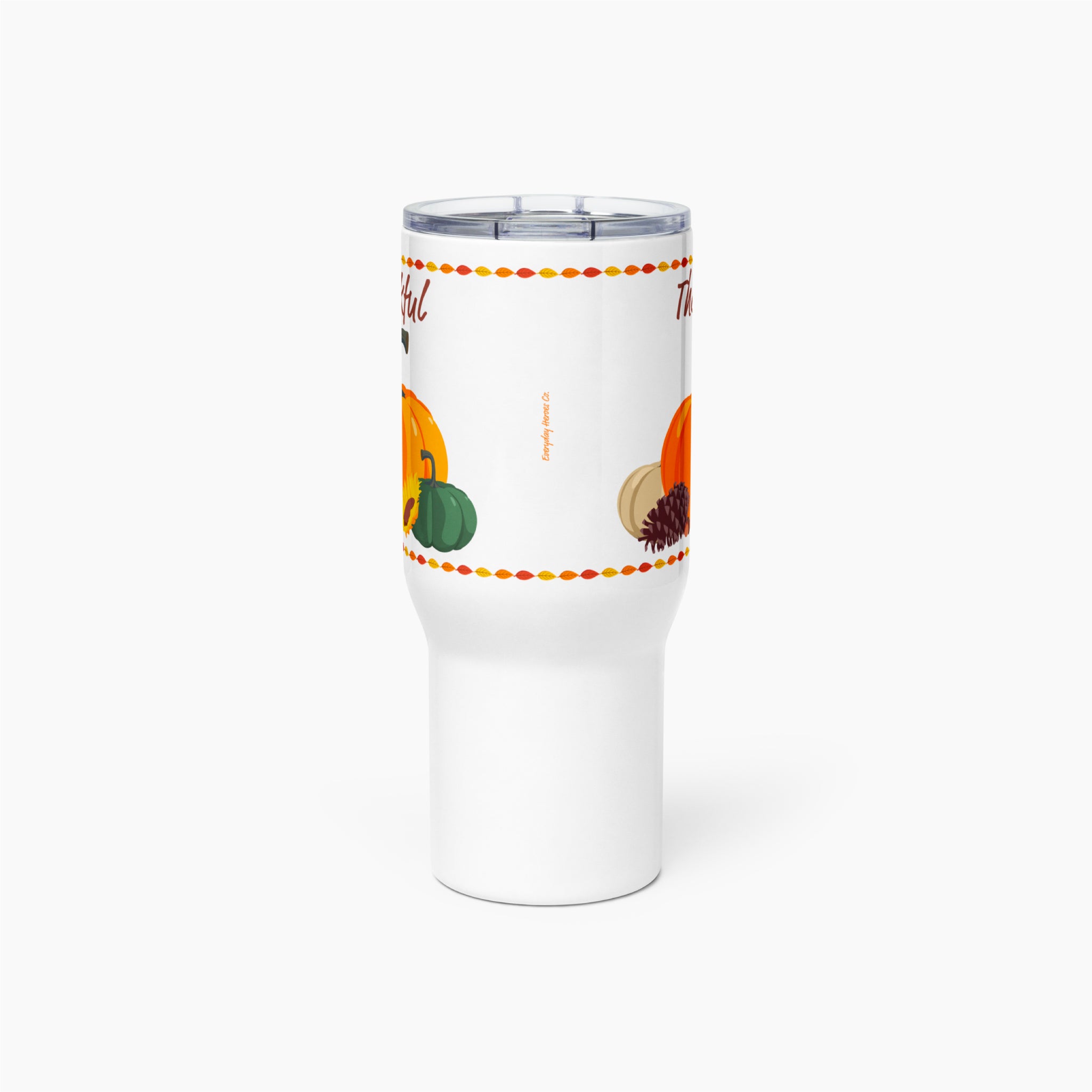 A white 20 oz insulated travel tumbler with a clear lid, featuring a printed autumn design with pumpkins, a green pumpkin, a pinecone, and a dotted orange and red leaf border.