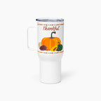 A White insulated travel tumbler with a clear lid and handle, featuring a Thanksgiving autumn graphic with pumpkins, a pinecone, acorns, sunflowers, and the word 'Thankful' in brown script.