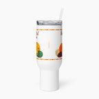 A white insulated travel tumbler with a clear lid and straw, featuring a fall harvest design with pumpkins and autumn-themed text, shown on a light gray background.