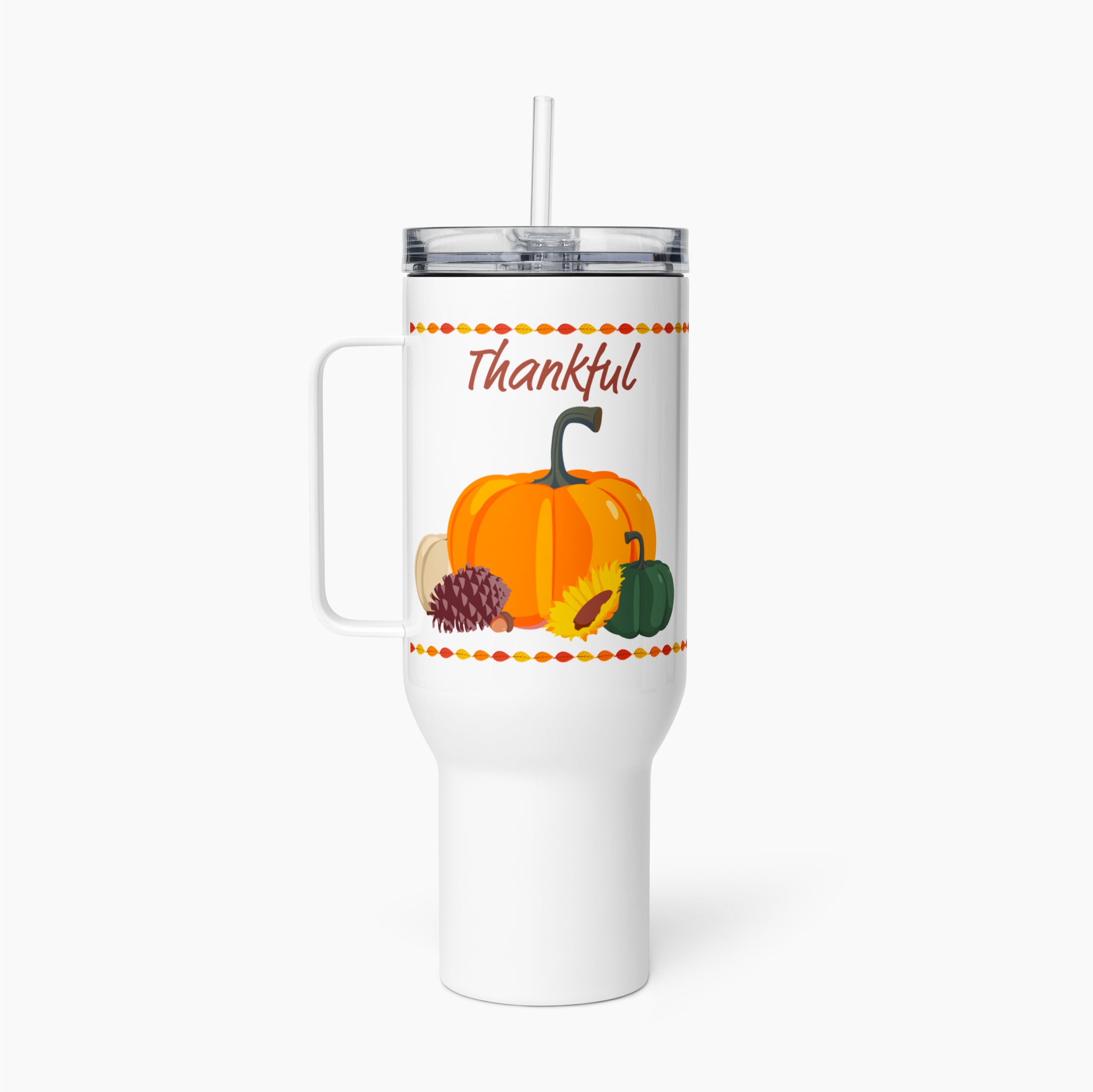 A white insulated travel tumbler with a handle, clear lid, and straw, featuring a fall harvest graphic with the word 'Thankful' above pumpkins, sunflower, pinecone, and acorn.
