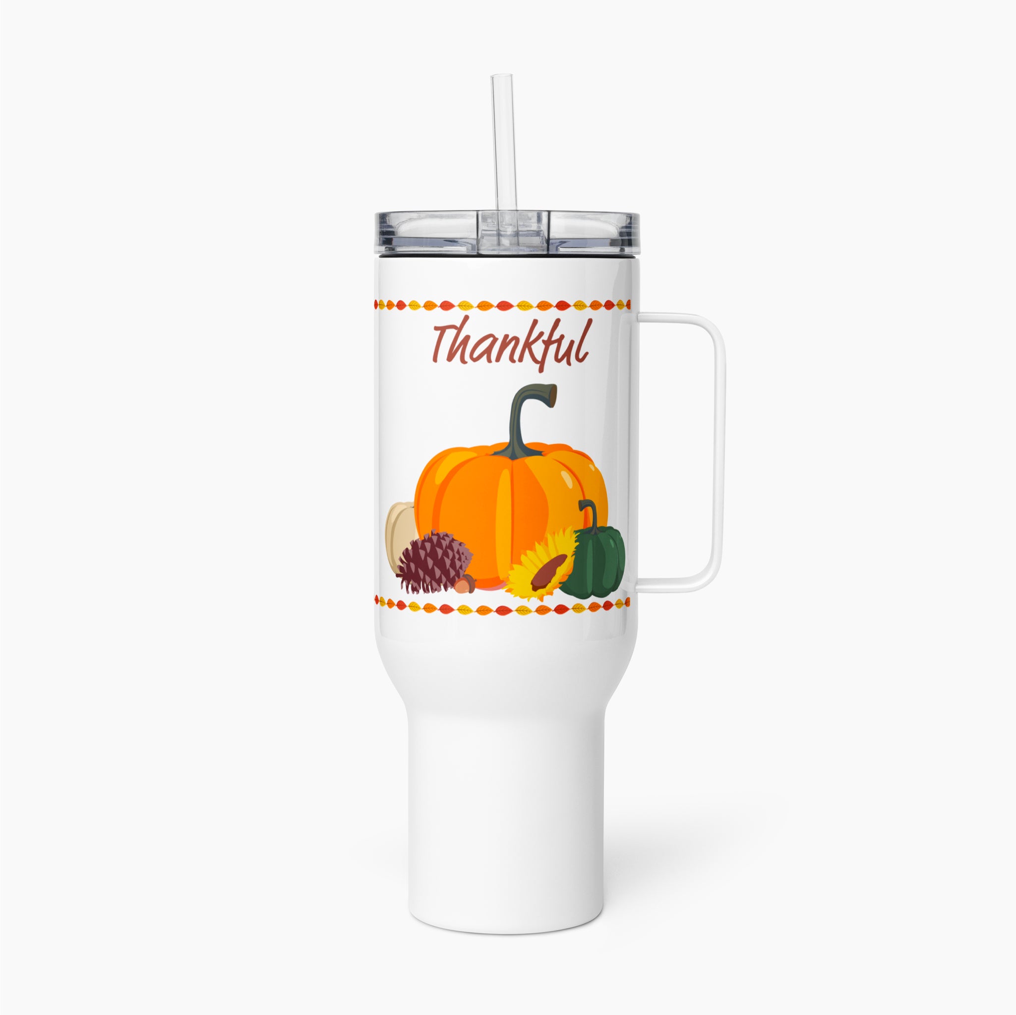 A white insulated travel tumbler with a handle, clear lid, and straw, featuring a fall harvest graphic with the word 'Thankful' and pumpkins, a pinecone, sunflower, and autumn accents.