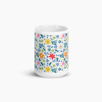 White mug with white floral pattern on a white background