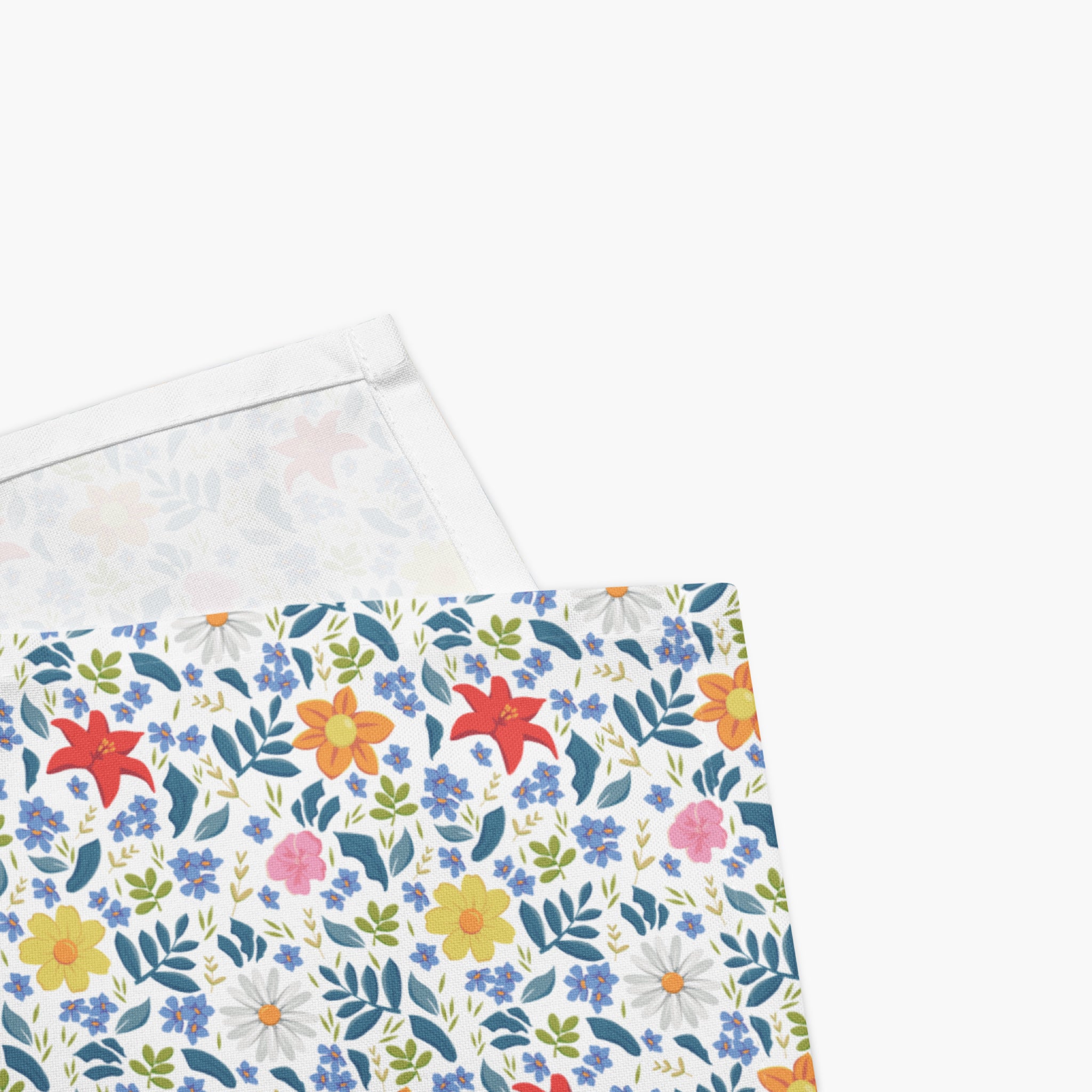 Floral-patterned cloth napkins with colorful flowers on a white background
