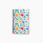 Spiral Notebook with white floral pattern on a white background