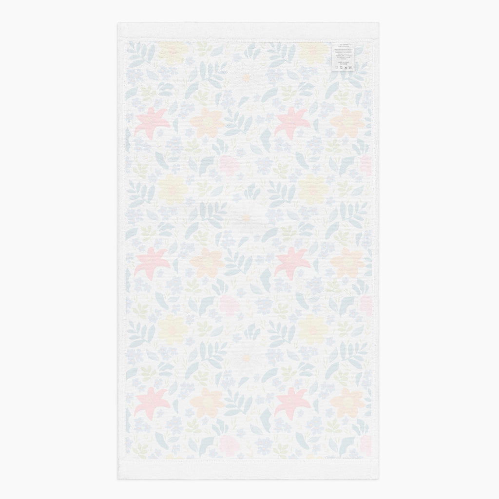 White back of Cloth kitchen hand towel with white floral pattern on a white background