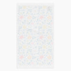 White back of Cloth kitchen hand towel with white floral pattern on a white background