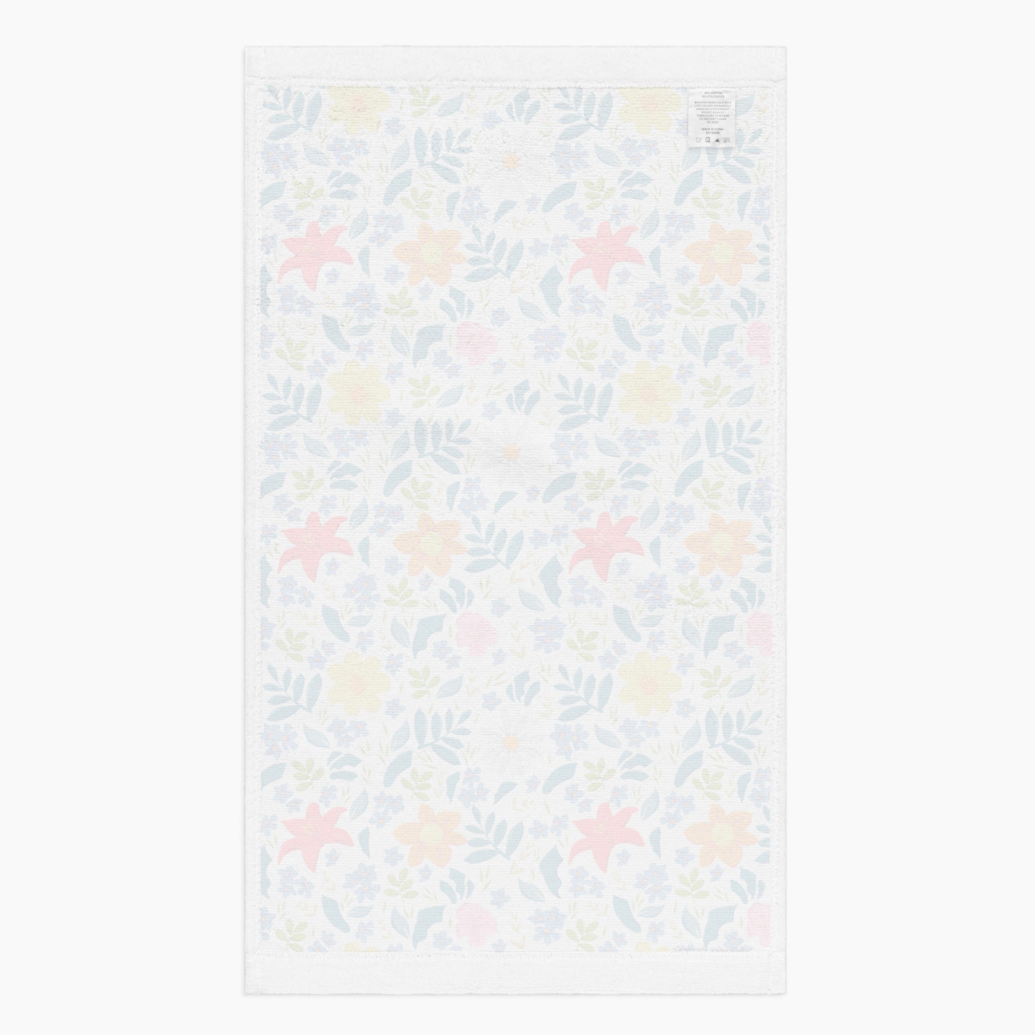 White back of Cloth kitchen hand towel with white floral pattern on a white background